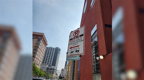 City removes permit-parking sign originally clipped over handicap parking